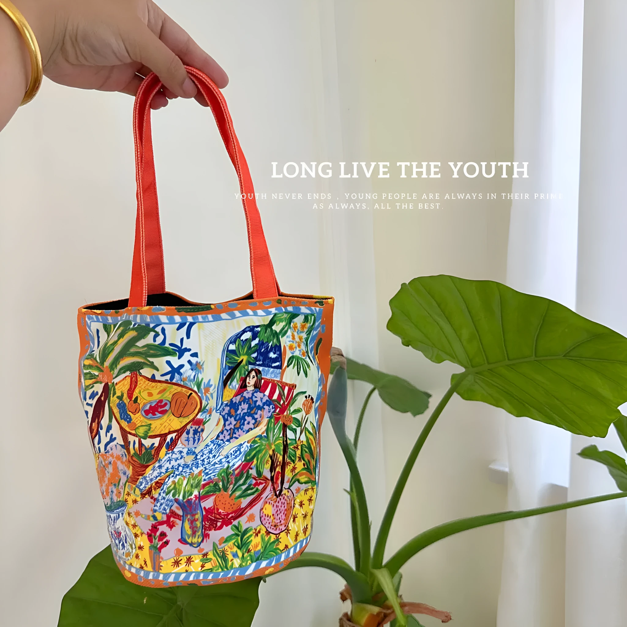 Dream Garden orange plush bucket bag with printed design, canvas lining, and double shoulder straps