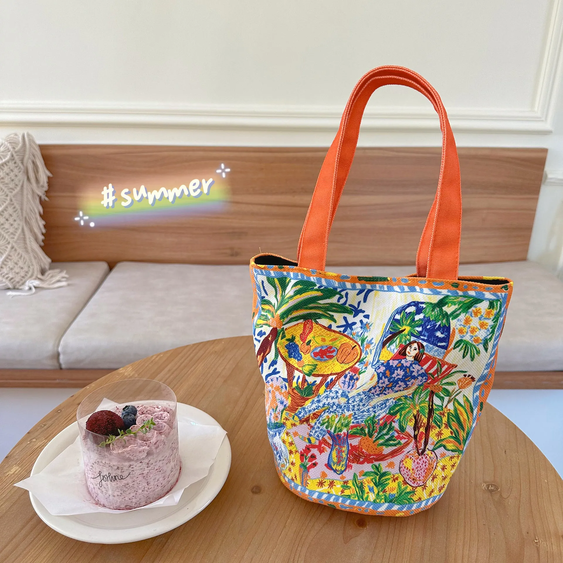 Dream Garden orange plush bucket bag with printed design, canvas lining, and double shoulder straps