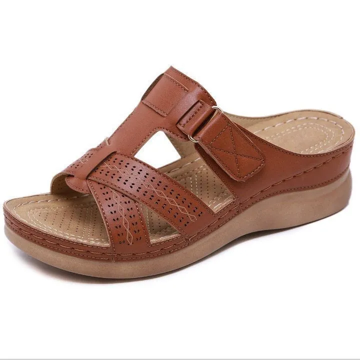 Women's red peep toe wedge sandals with Velcro strap on a fish mouth sole.