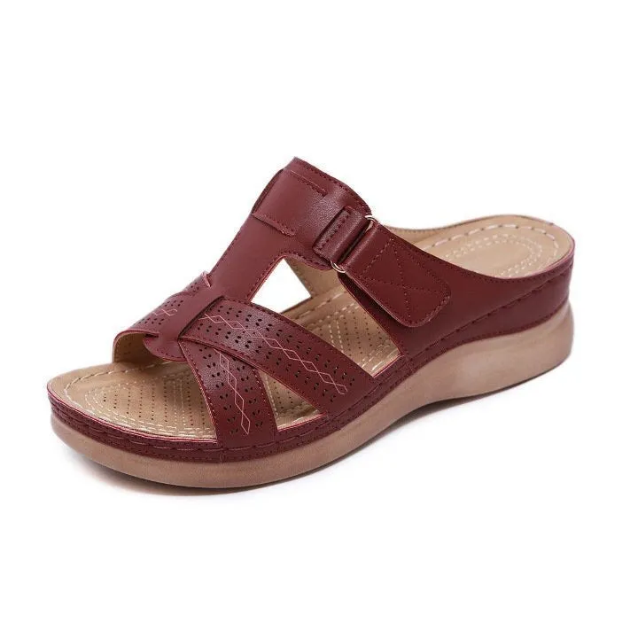 Women's red peep toe wedge sandals with Velcro strap on a fish mouth sole.