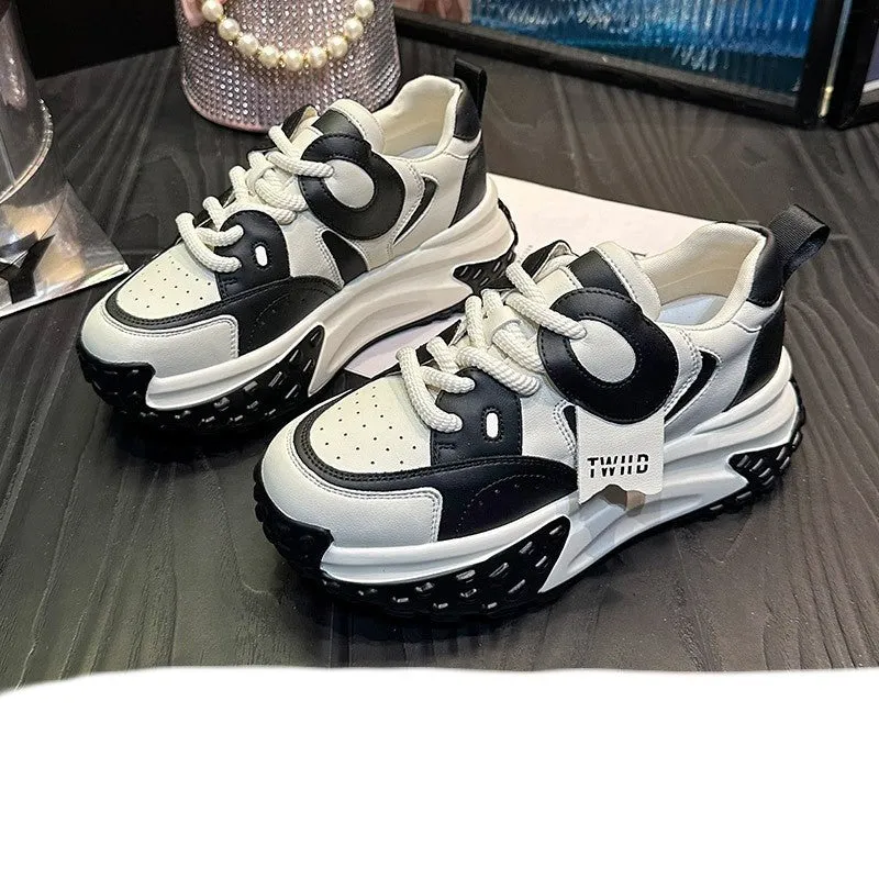 Men's thick-soled leather casual shoes in black and white colour with round toe and lace-up front.