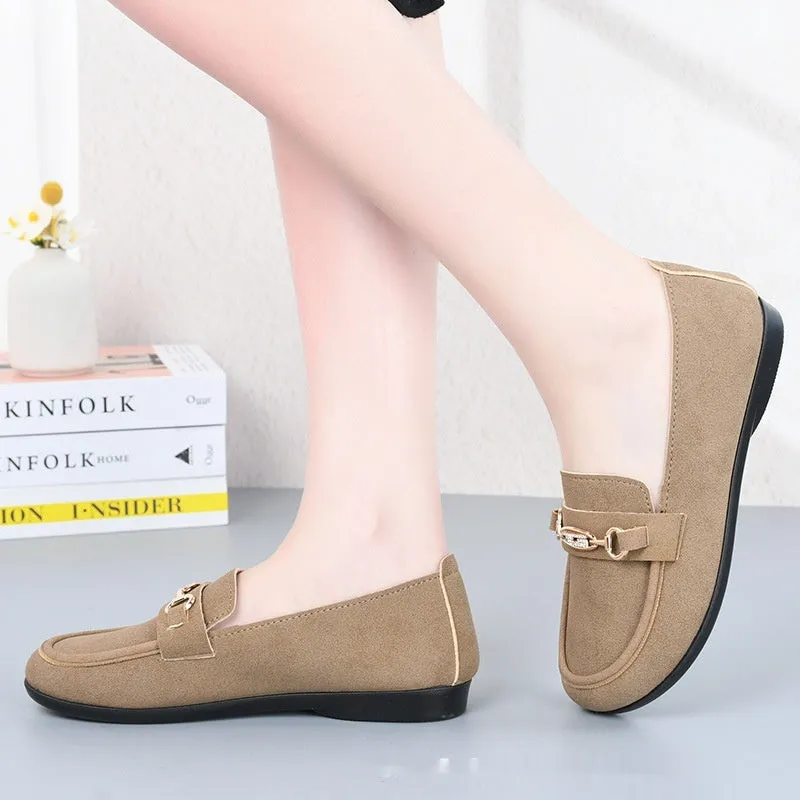 Women's black matte slip-on casual shoes with a round toe and soft rubber sole on a flat surface.