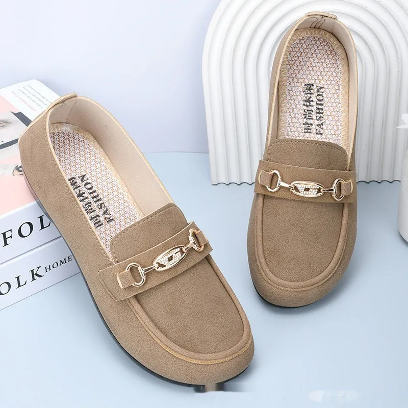 Women's black matte slip-on casual shoes with a round toe and soft rubber sole on a flat surface.