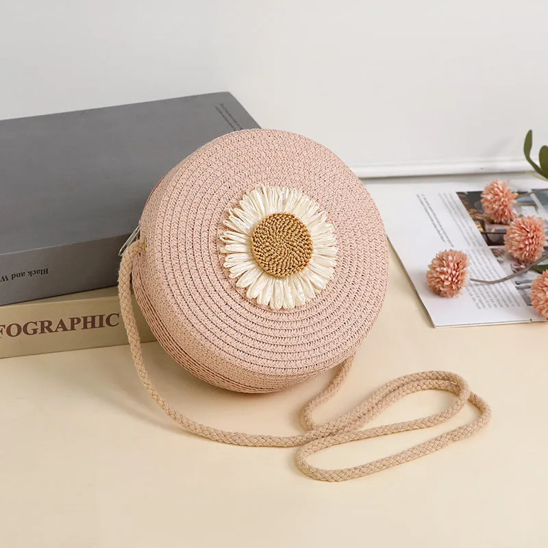 Woven straw crossbody bag in pastoral style, shown in one of eight colours, designed to hold a mobile phone.