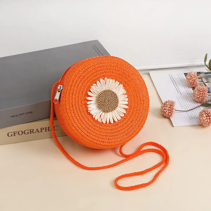 Woven straw crossbody bag in pastoral style, shown in one of eight colours, designed to hold a mobile phone.