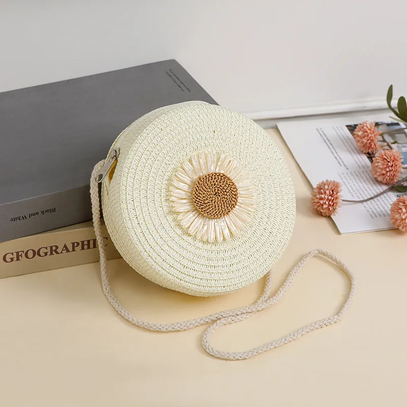 Woven straw crossbody bag in pastoral style, shown in one of eight colours, designed to hold a mobile phone.