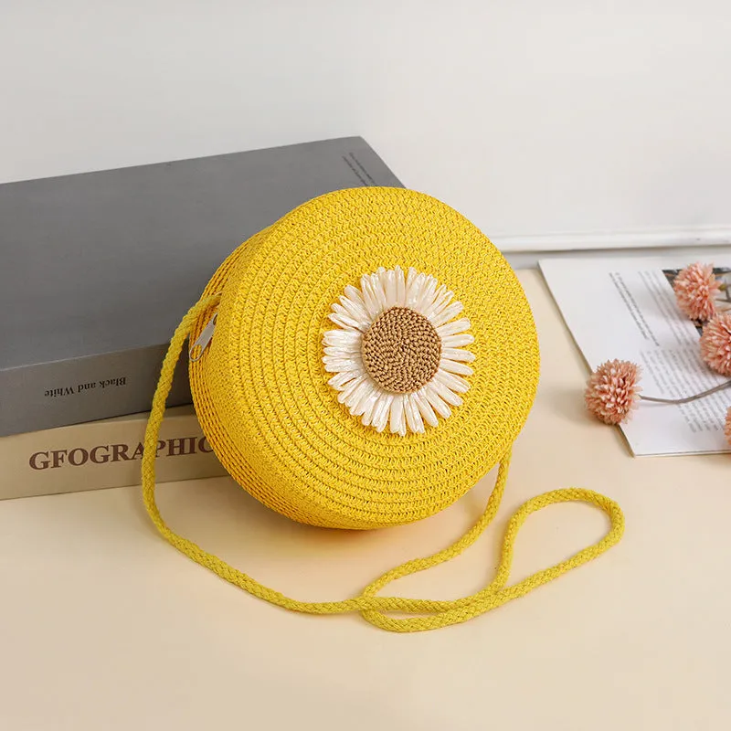 Woven straw crossbody bag in pastoral style, shown in one of eight colours, designed to hold a mobile phone.
