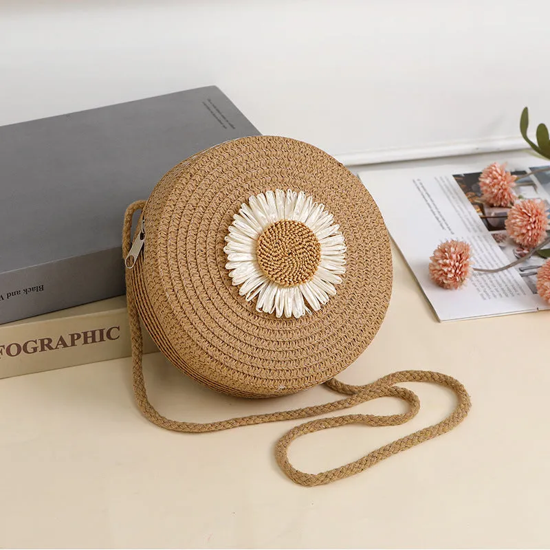 Woven straw crossbody bag in pastoral style, shown in one of eight colours, designed to hold a mobile phone.