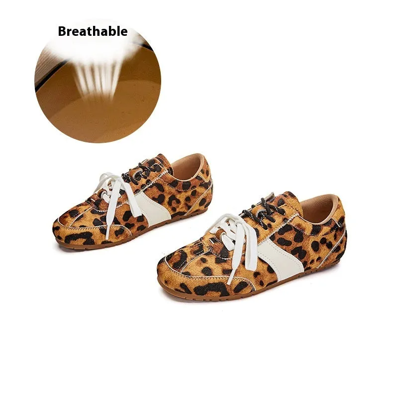 Women's white casual lace-up shoes with horsehair flocked detailing on leather upper, flat heel and round toe.