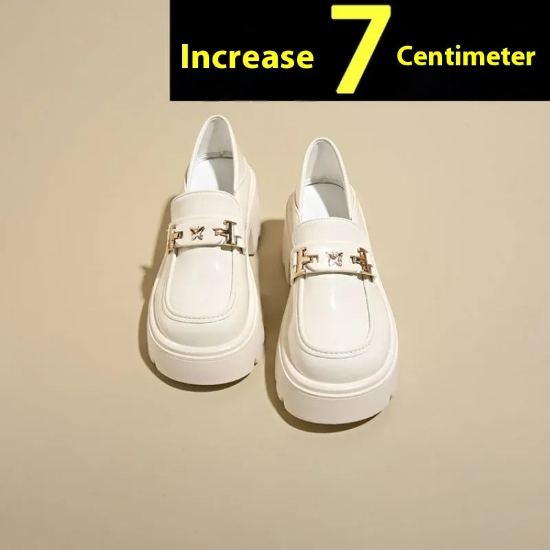 Black women's slip-on shoes with a skull pattern, chunky square heel, and round toe on a white background.
