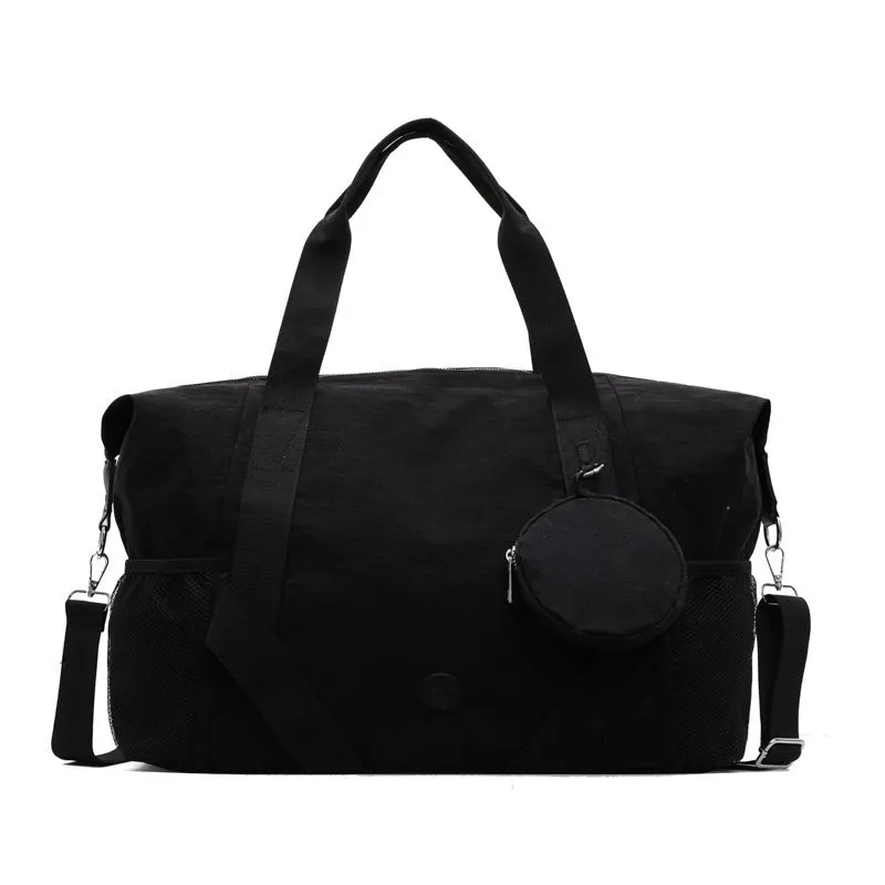 Lightweight black and green Oxford cloth gym bag with polyester lining.