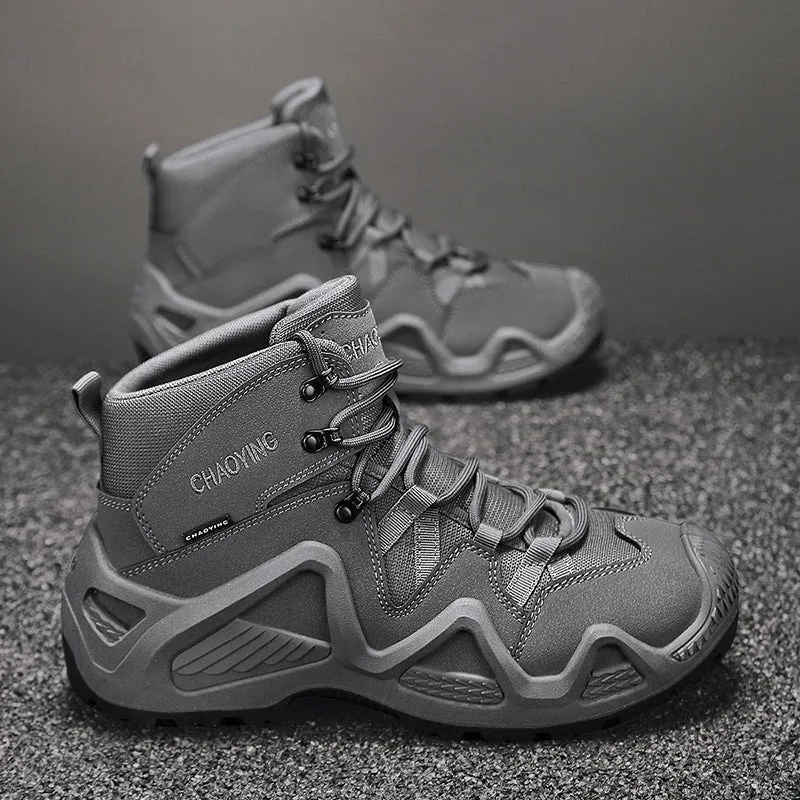 Black canvas high-top tactical boot with rubber sole and cross strap detail on a white background.