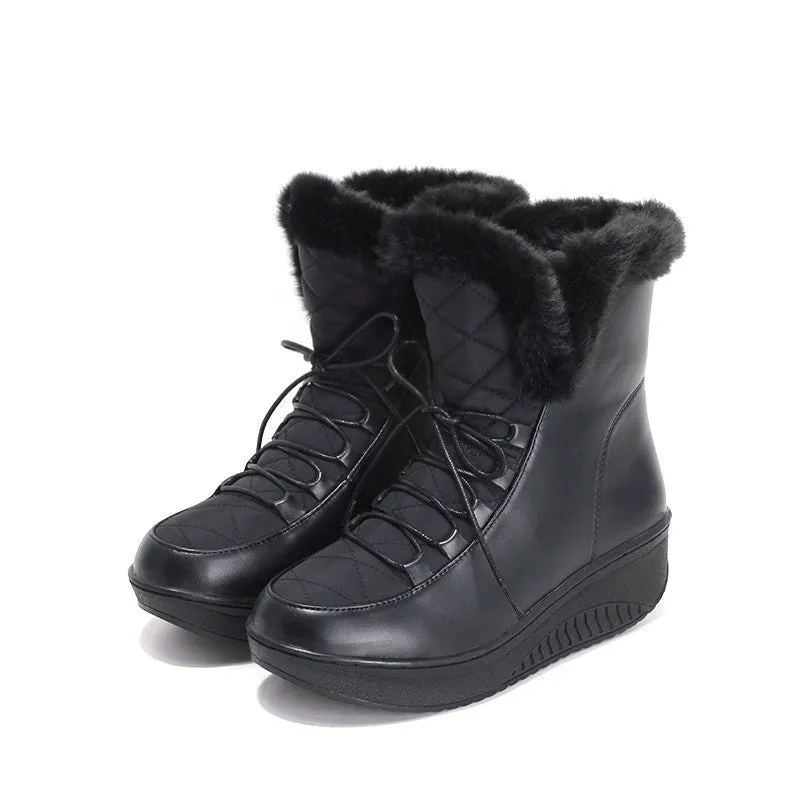Black women's lace-up winter boots with a platform sole on a neutral background.