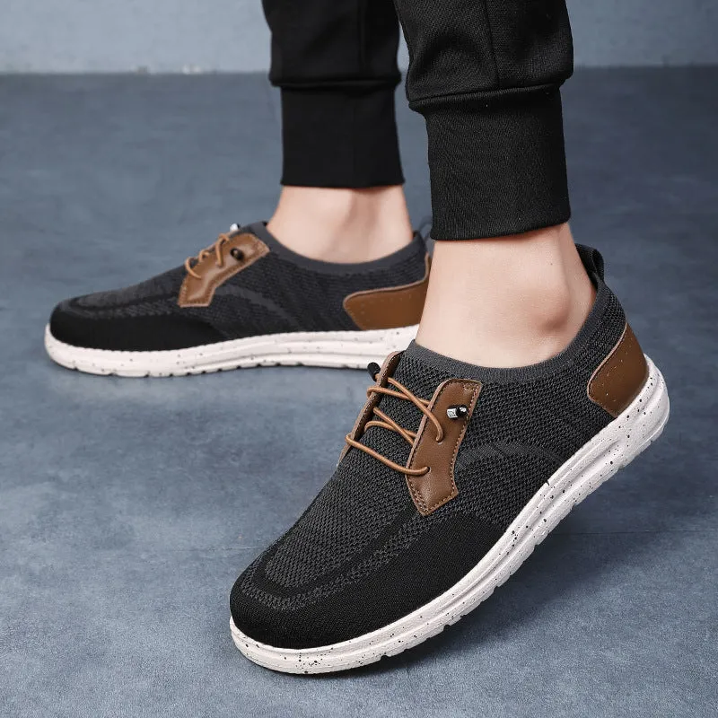 Men's black laceless canvas shoes with low-top design and round toe