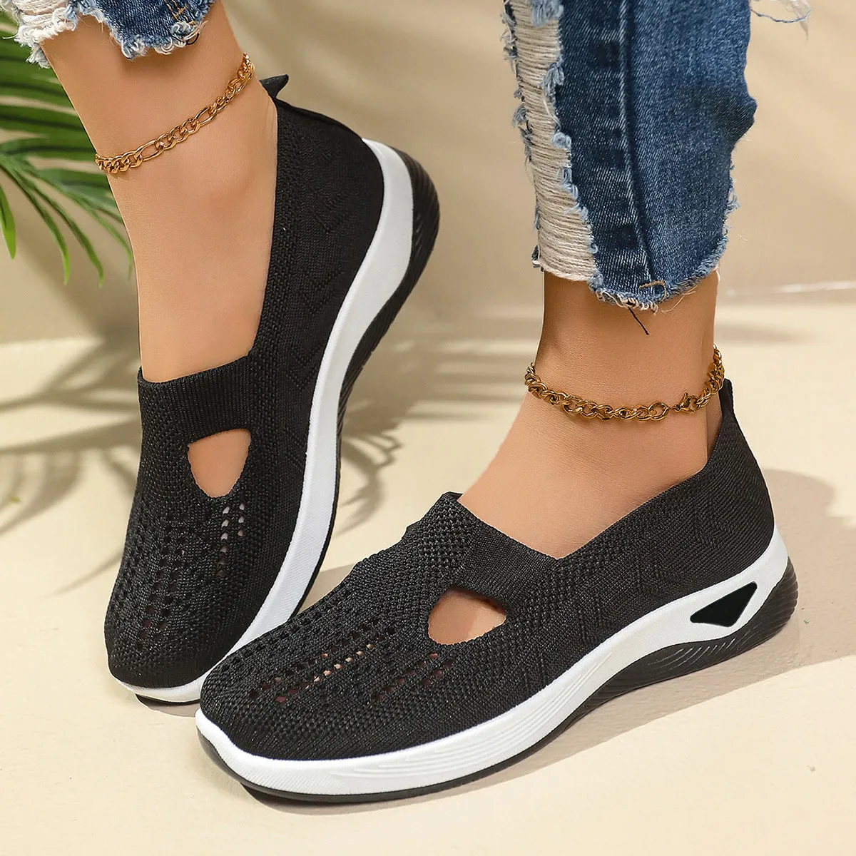 Women's low-top slip-on shoe in Flyknit mesh, shown in a choice of colours with a soft PVC sole.