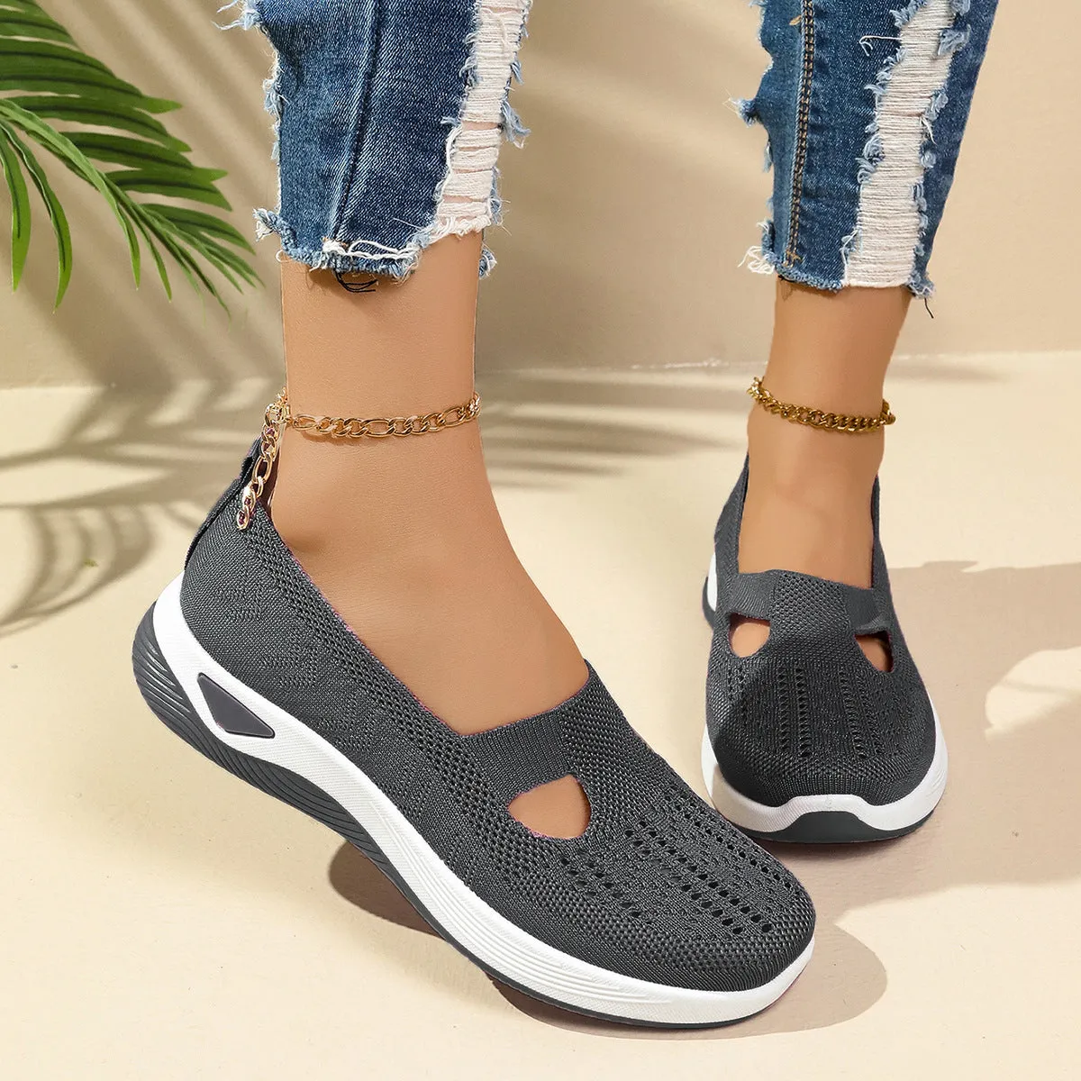 Women's low-top slip-on shoe in Flyknit mesh, shown in a choice of colours with a soft PVC sole.