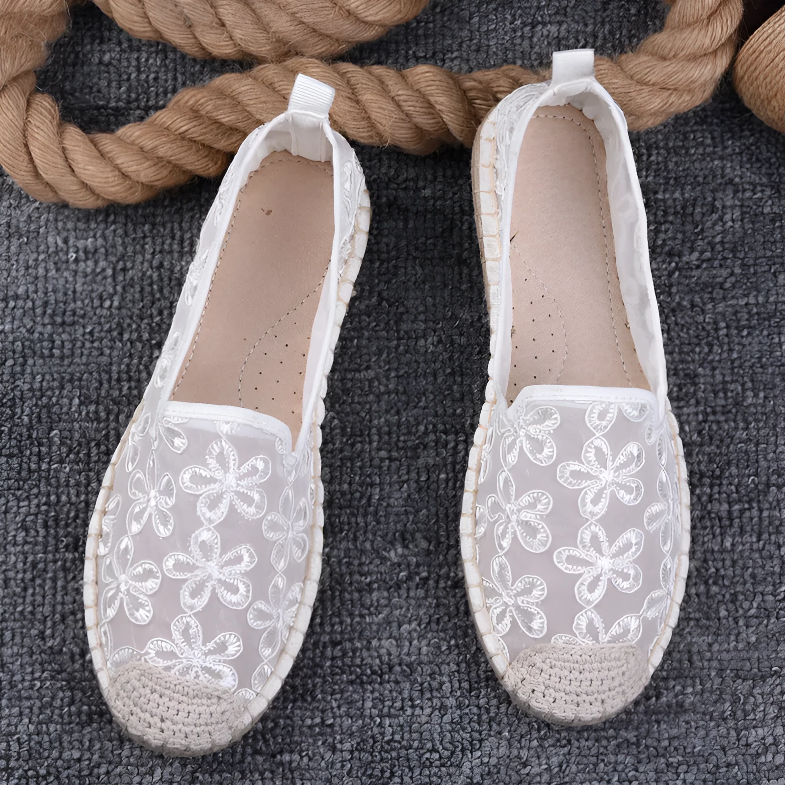 Women's flat-heel linen fisherman shoes in pansy white with sewing thread detail and round toe.