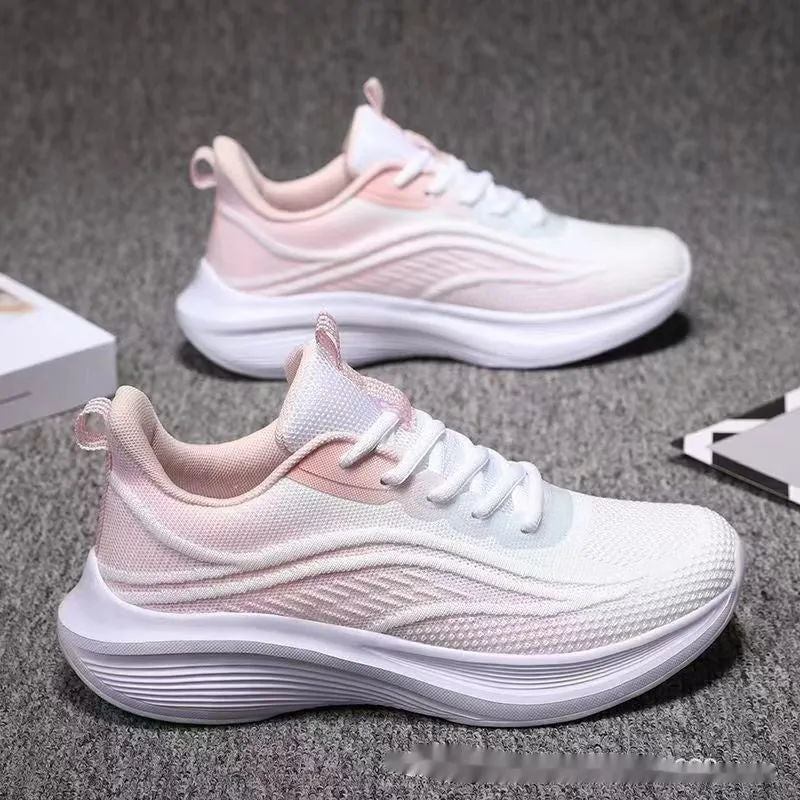 Women's low-top mesh running shoes in light pink with a round toe and front lace-up closure.
