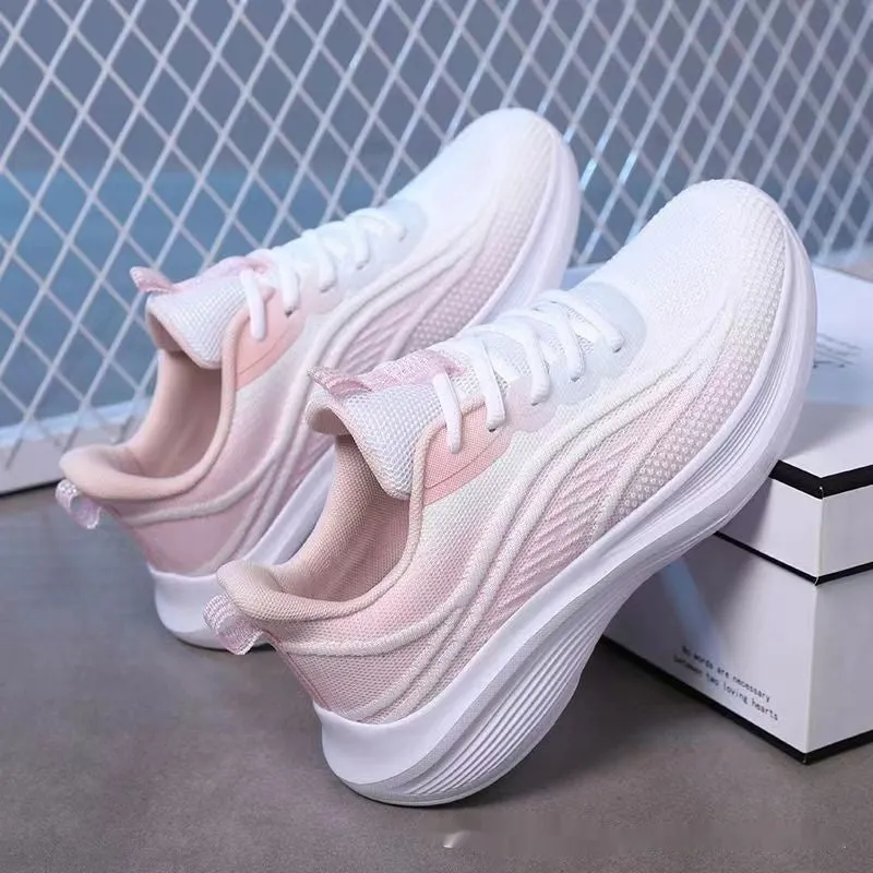 Women's low-top mesh running shoes in light pink with a round toe and front lace-up closure.