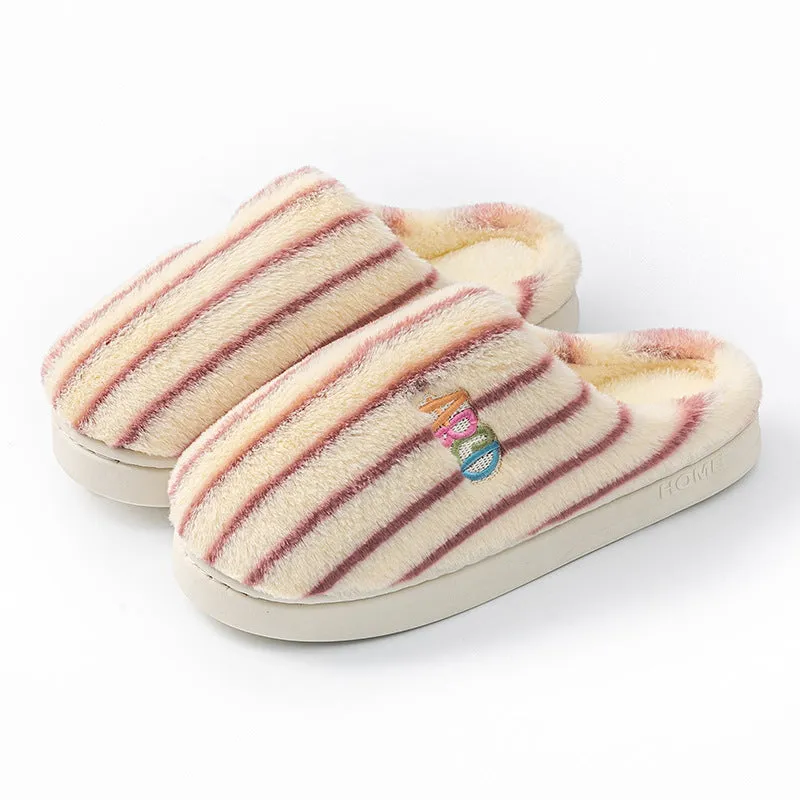 A pair of soft cotton adult slippers with a plastic sole, shown in one of five colour options.