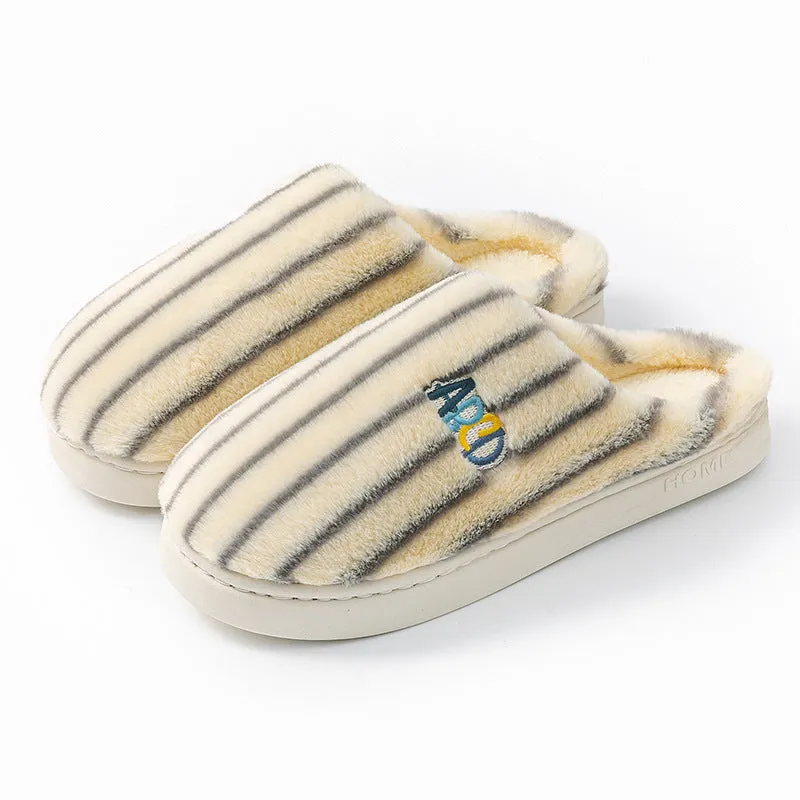 A pair of soft cotton adult slippers with a plastic sole, shown in one of five colour options.