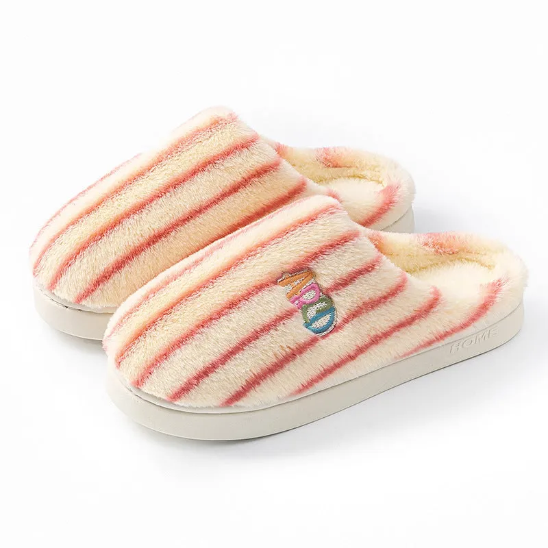 A pair of soft cotton adult slippers with a plastic sole, shown in one of five colour options.