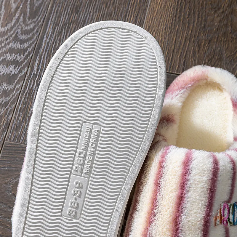 A pair of soft cotton adult slippers with a plastic sole, shown in one of five colour options.