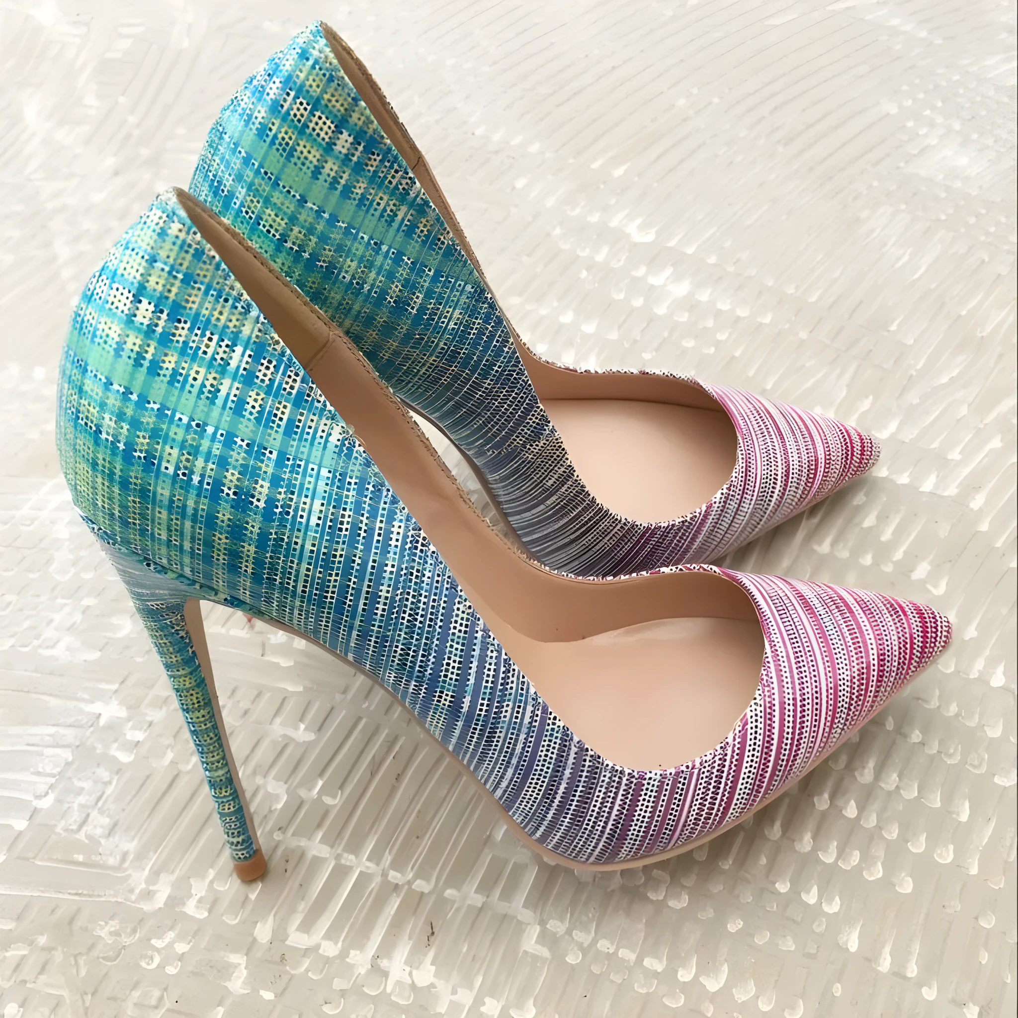 Ladies' pink-to-blue gradient patent leather high-heel shoe with a pointed toe on a rubber sole.