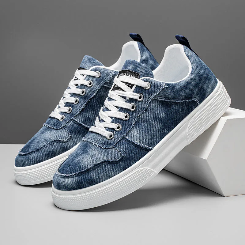 Men's low-top blue canvas sneakers with white platform sole and lace-up front.