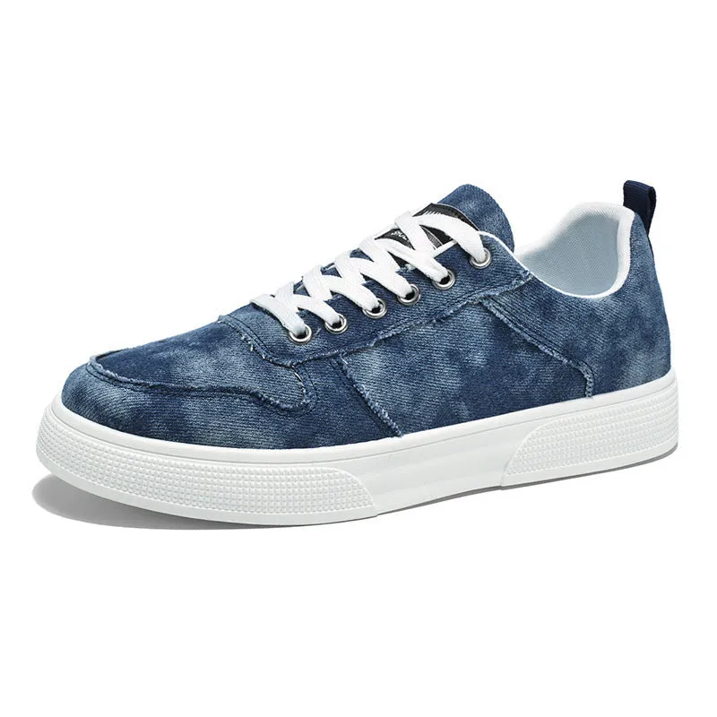 Men's low-top blue canvas sneakers with white platform sole and lace-up front.