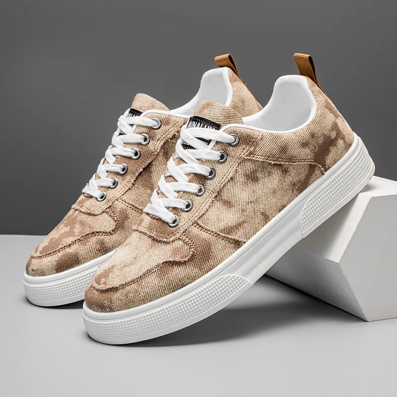Men's low-top blue canvas sneakers with white platform sole and lace-up front.