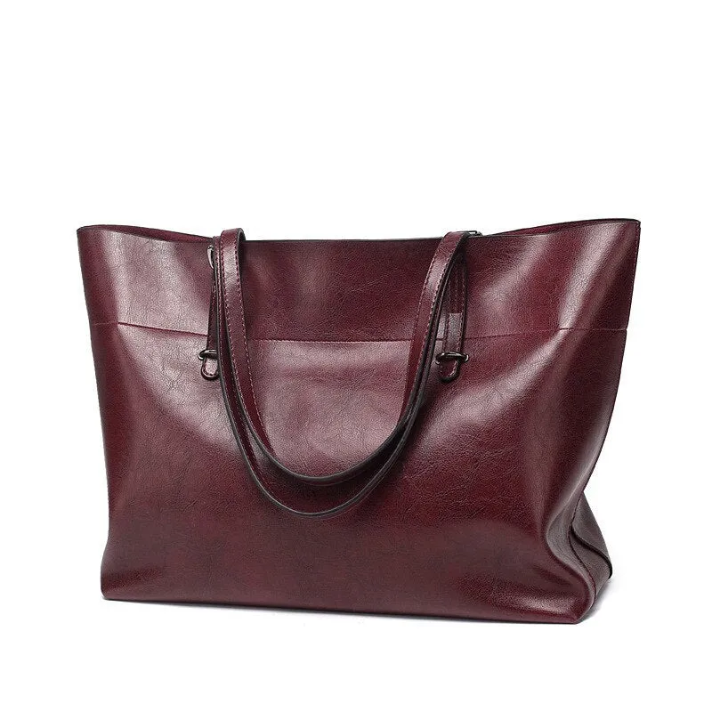 Horizontal waxed cowhide leather women's crossbody handbag showing internal phone pocket and two compartments.