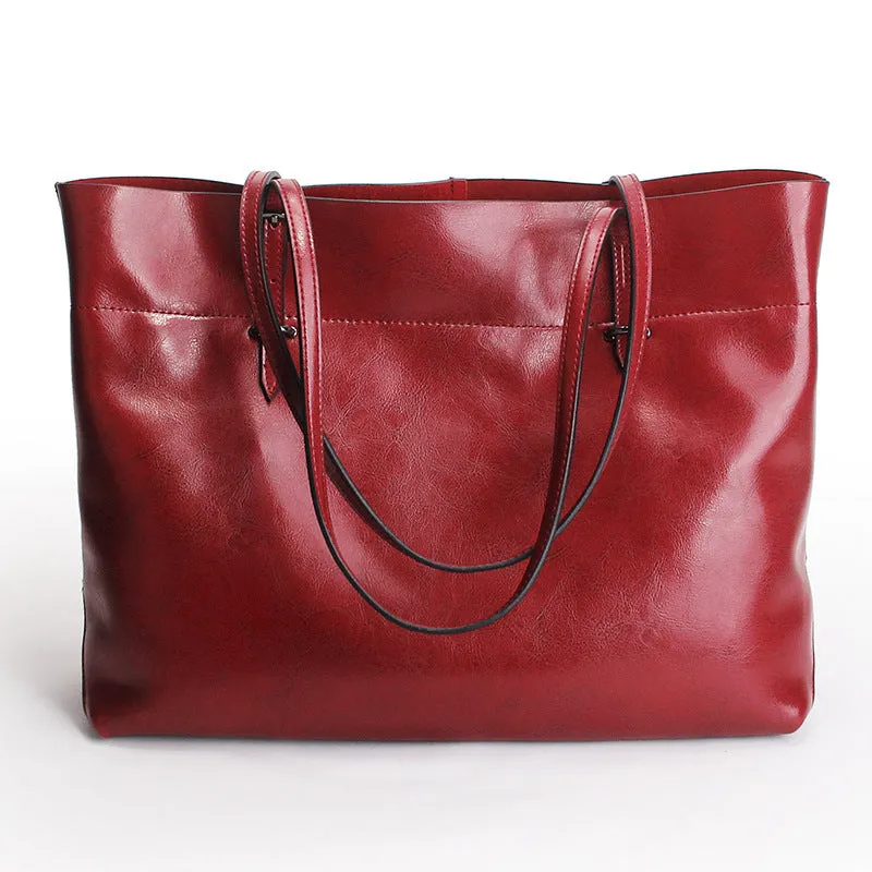 Horizontal waxed cowhide leather women's crossbody handbag showing internal phone pocket and two compartments.