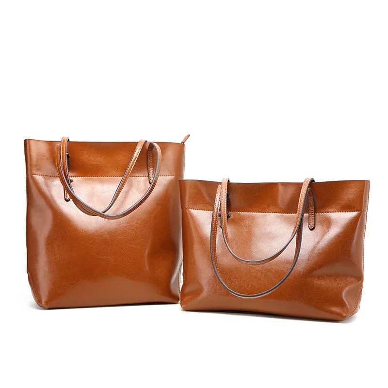 Horizontal waxed cowhide leather women's crossbody handbag showing internal phone pocket and two compartments.