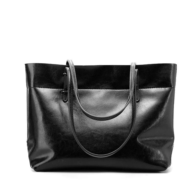 Horizontal waxed cowhide leather women's crossbody handbag showing internal phone pocket and two compartments.