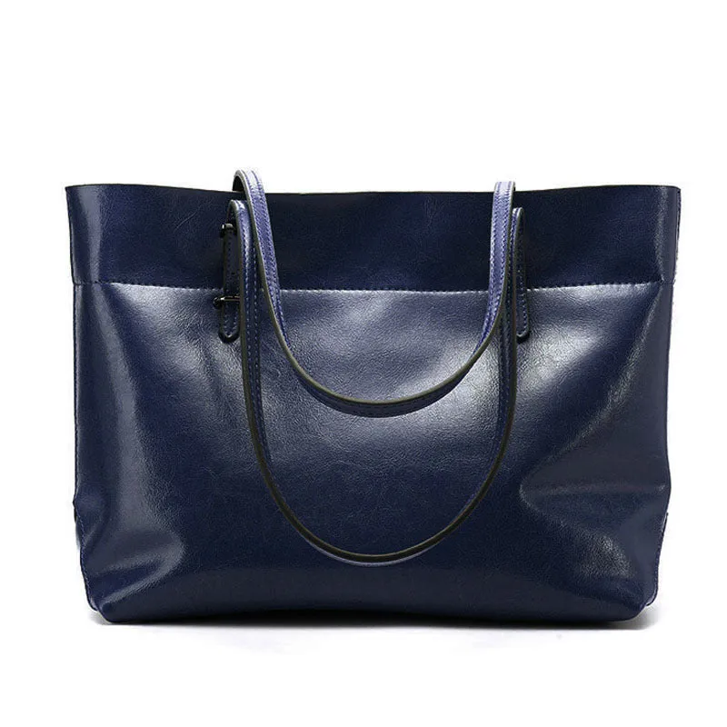 Horizontal waxed cowhide leather women's crossbody handbag showing internal phone pocket and two compartments.