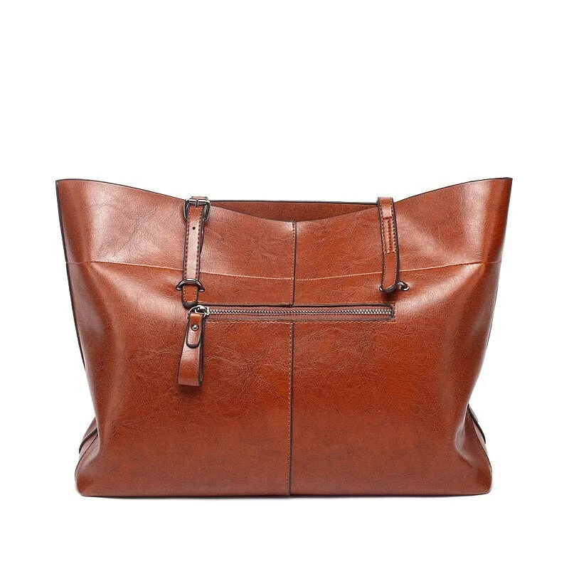 Horizontal waxed cowhide leather women's crossbody handbag showing internal phone pocket and two compartments.