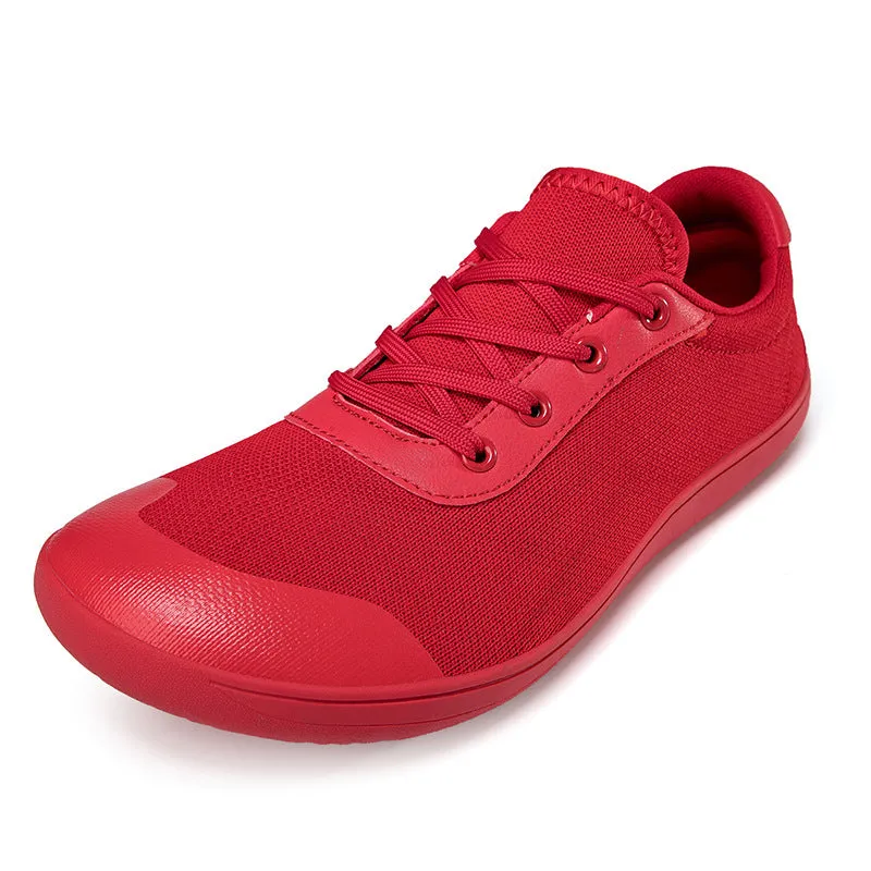 Men's low-top training shoe in a solid colour with a mesh upper and ribbed outsole, shown in a larger size.