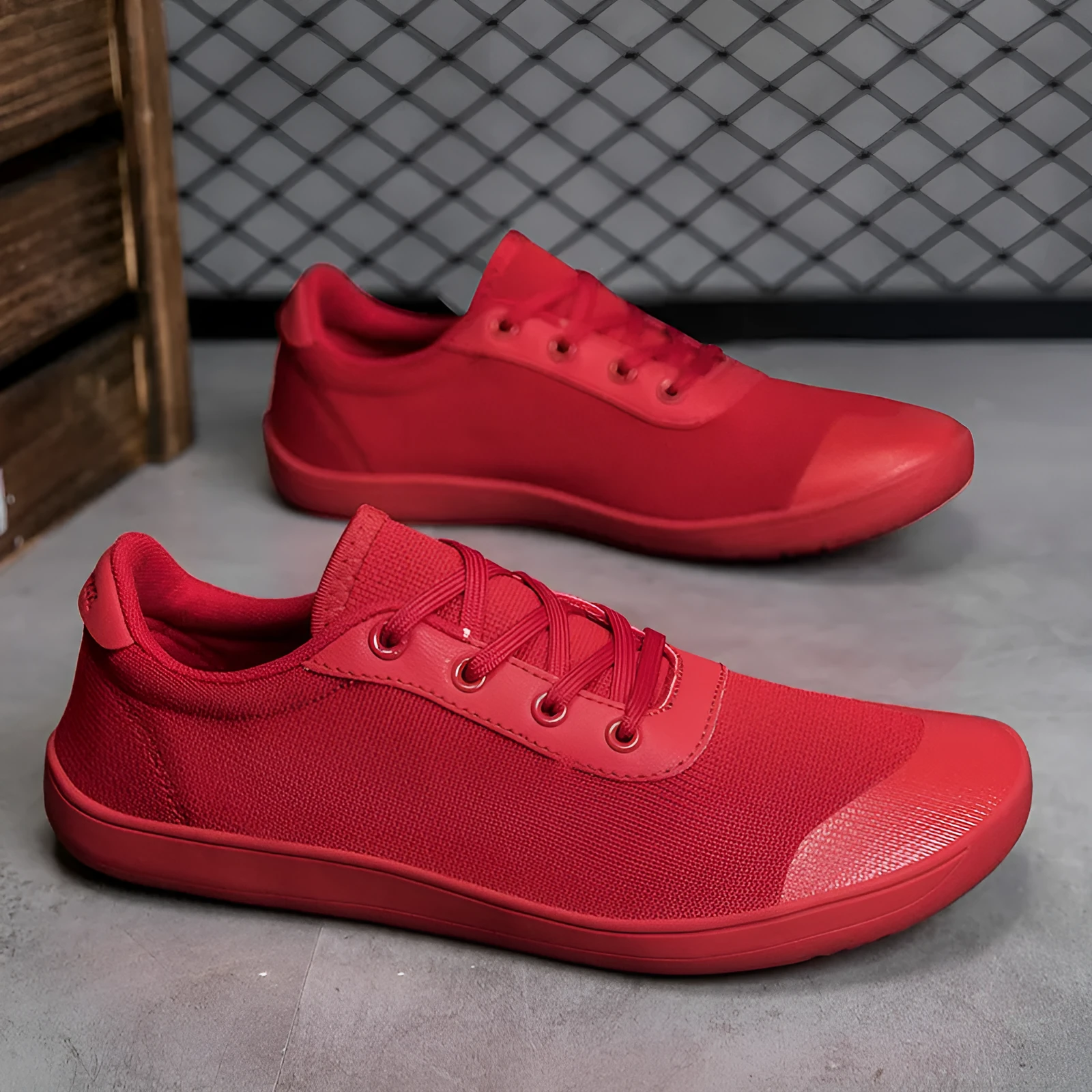 Men's low-top training shoe in a solid colour with a mesh upper and ribbed outsole, shown in a larger size.