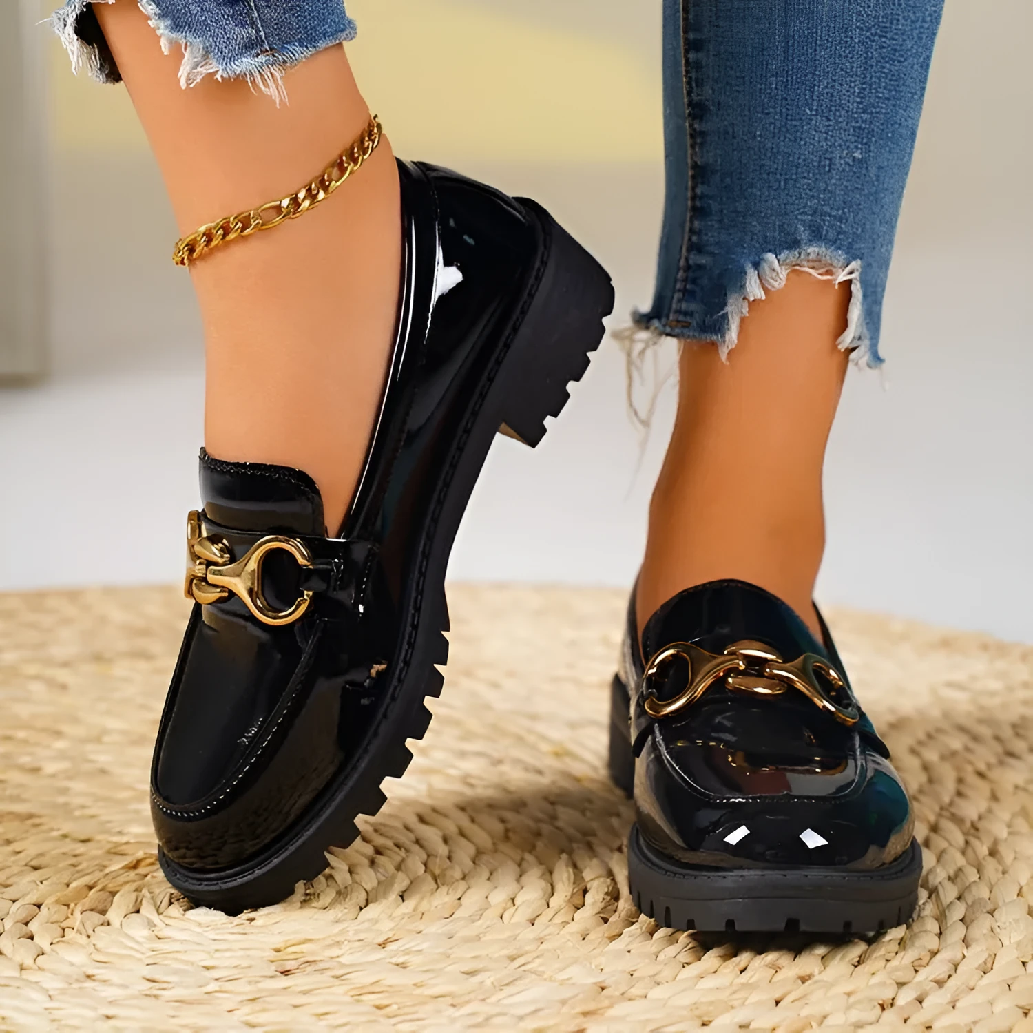 Women's black chunky heel pumps with round toe, thick rubber soles, and metal decorative accents
