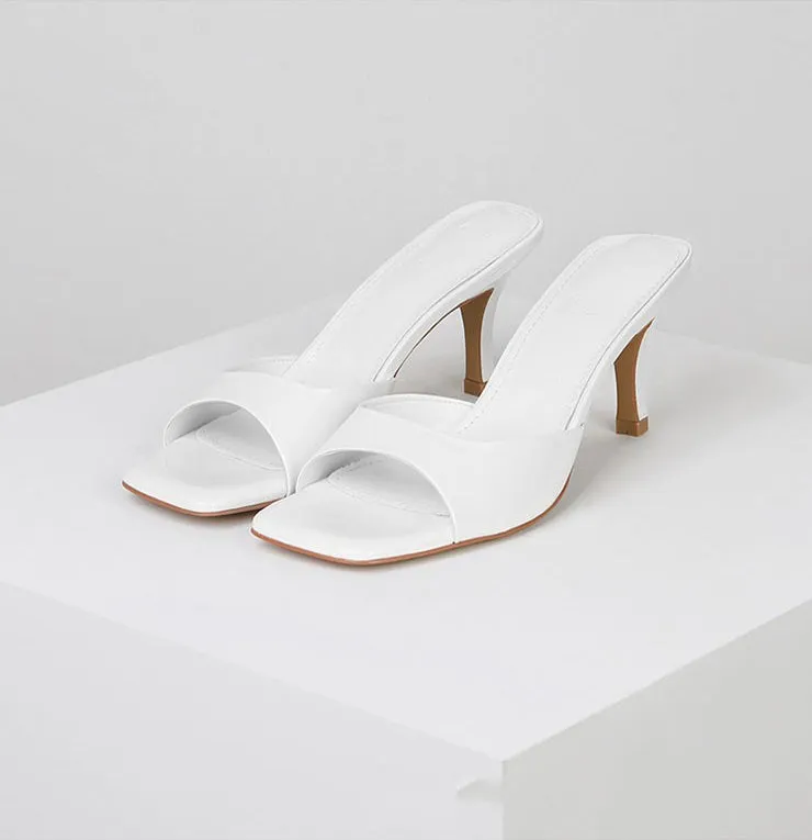 Women's square toe stiletto heel sandals in nude, black, and white on a rubber sole