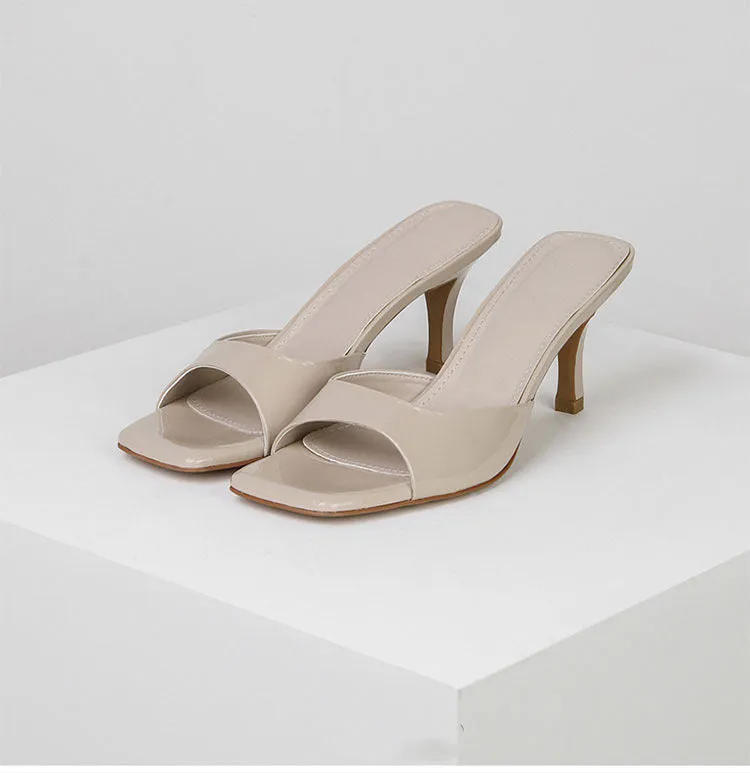 Women's square toe stiletto heel sandals in nude, black, and white on a rubber sole