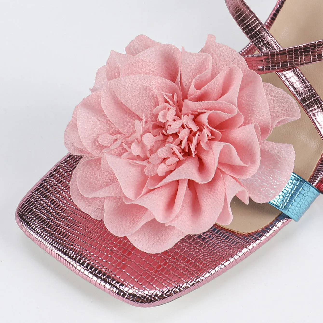 Pink women's high heel sandals with a square toe, 3D floral detail, and a tall heel.