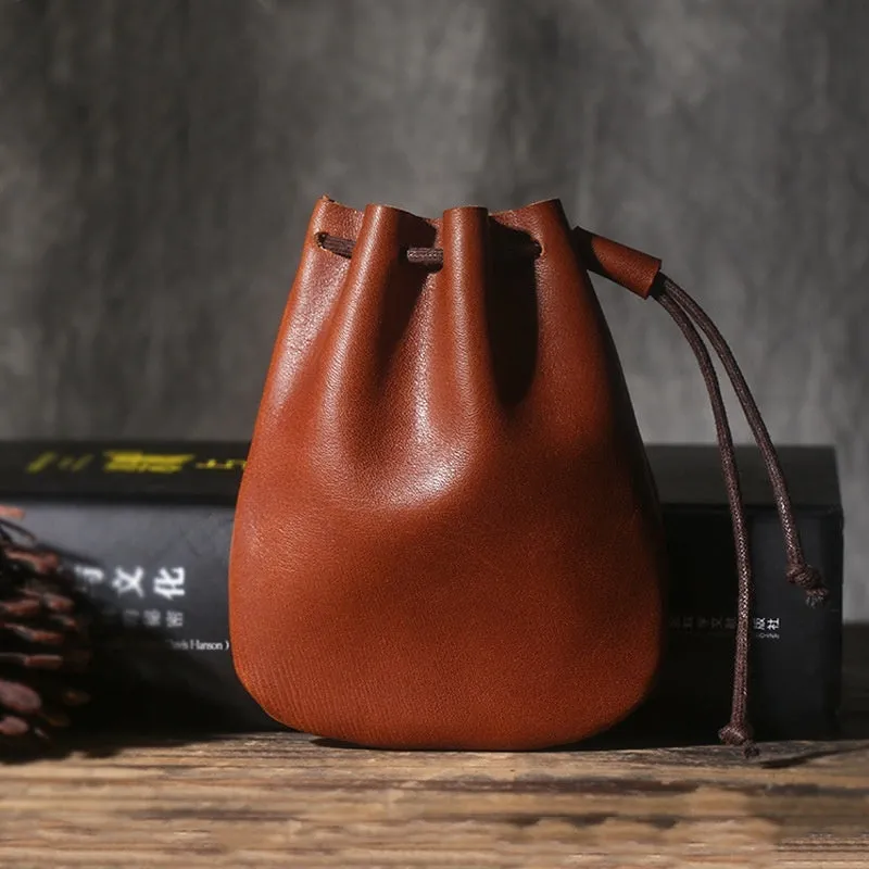 Genuine cowhide leather drawstring bundle wallet in retro style shown in black and chocolate colours.