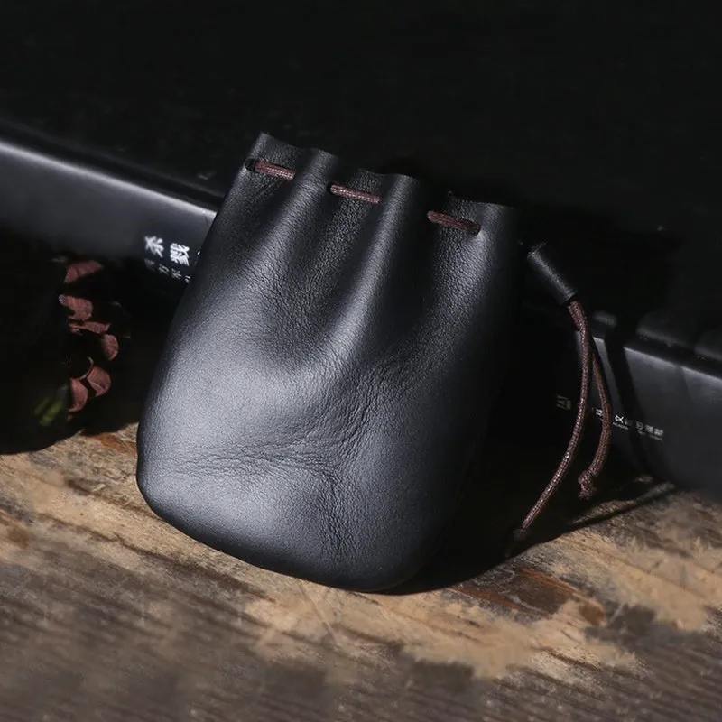 Genuine cowhide leather drawstring bundle wallet in retro style shown in black and chocolate colours.