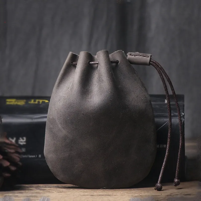 Genuine cowhide leather drawstring bundle wallet in retro style shown in black and chocolate colours.