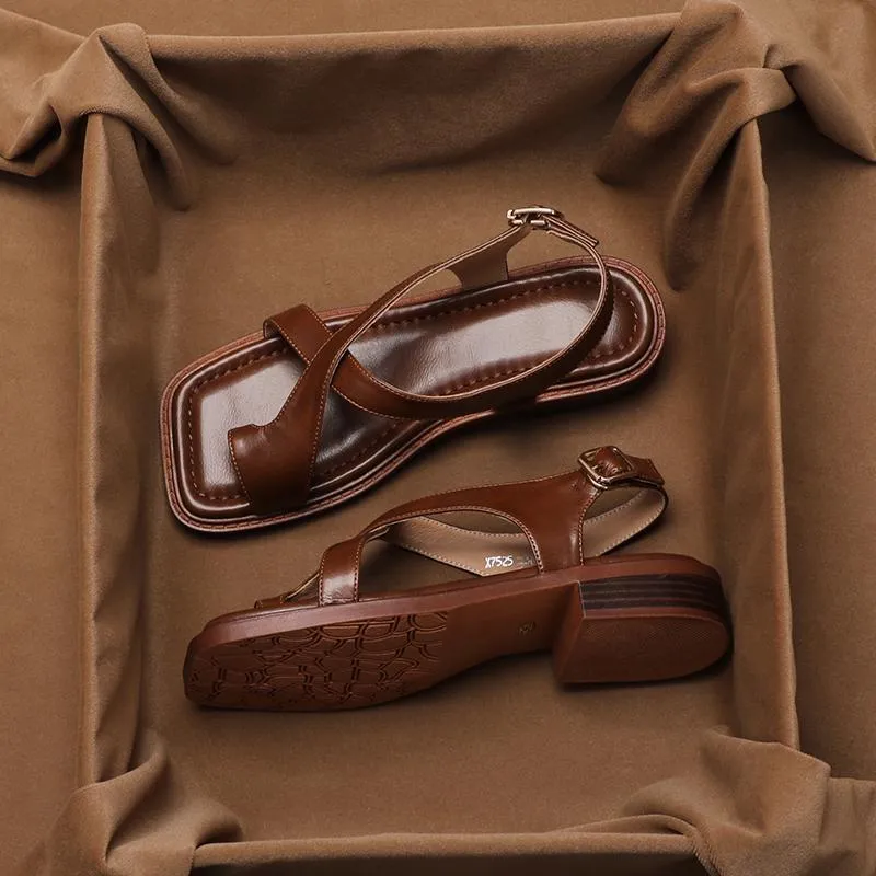 French retro brown toe ring sandals with square toe and ankle-strap buckle on a neutral background