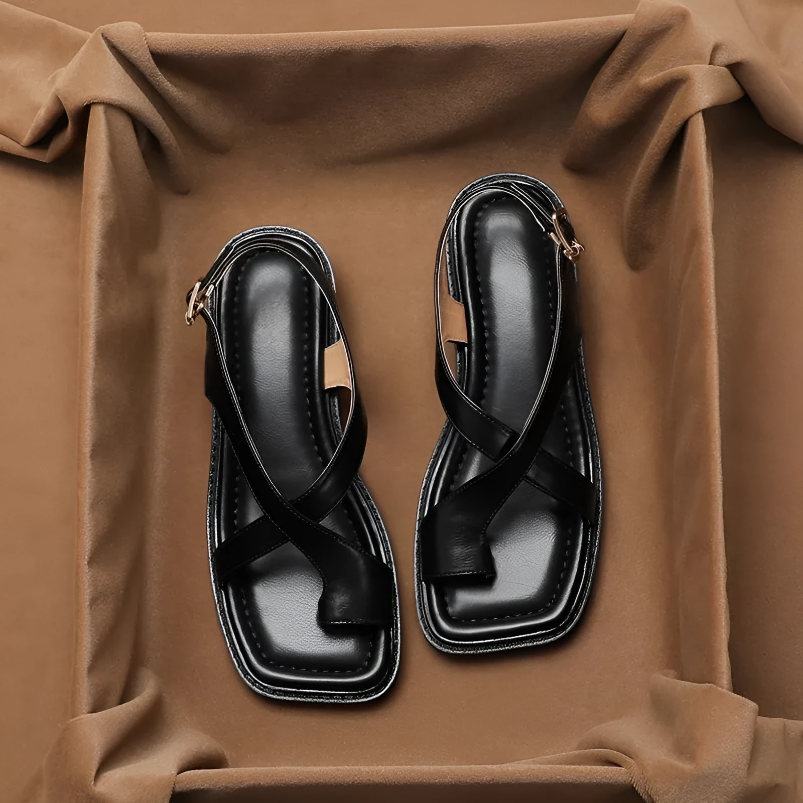 French retro brown toe ring sandals with square toe and ankle-strap buckle on a neutral background