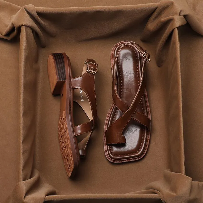 French retro brown toe ring sandals with square toe and ankle-strap buckle on a neutral background