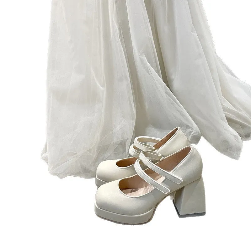 White Mary Jane chunky heel wedding shoes with square toe and buckle closure on a white background